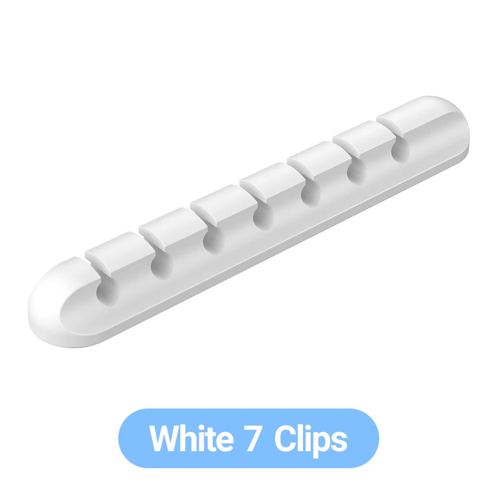 WaveGear Inc. WireNest™ adhesive cable holder securing multiple cables in a sleek, transparent design on a desk surface.