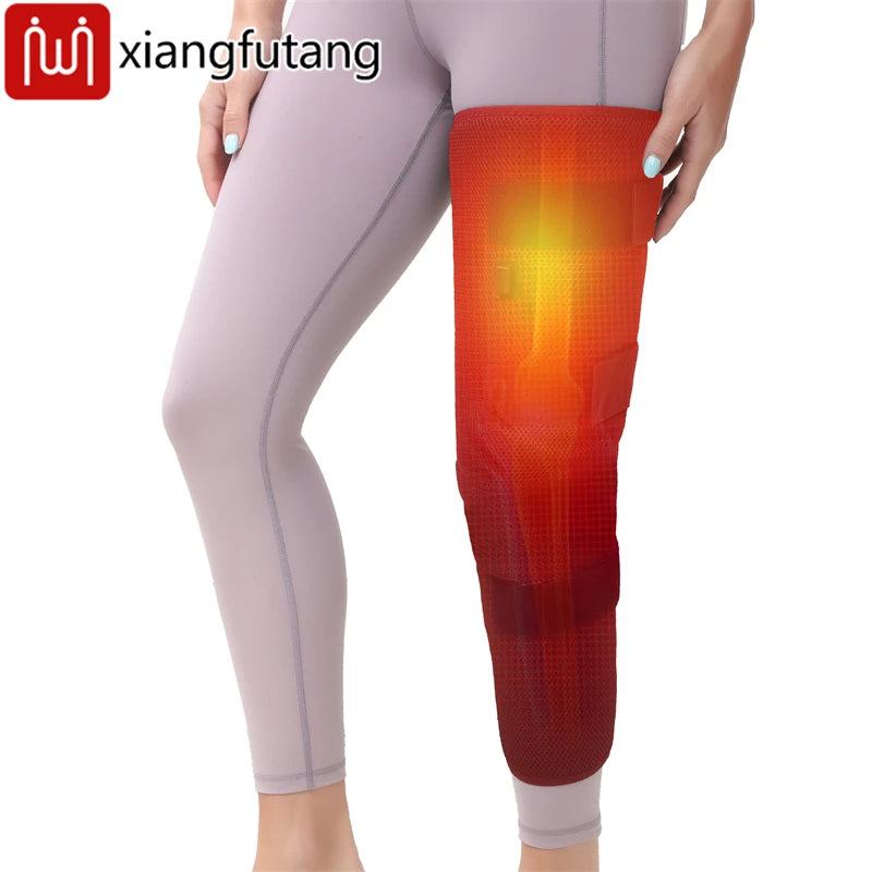 WaveGear Inc. Leg heating pad with vibration massager, showing a close-up of the padded device on a person's leg for muscle relief.