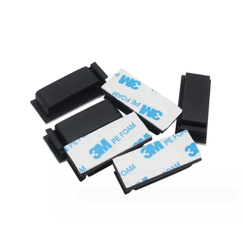 WaveGear Inc. cable organizer wire clip holding and securing multiple charging and data cables neatly on a surface.