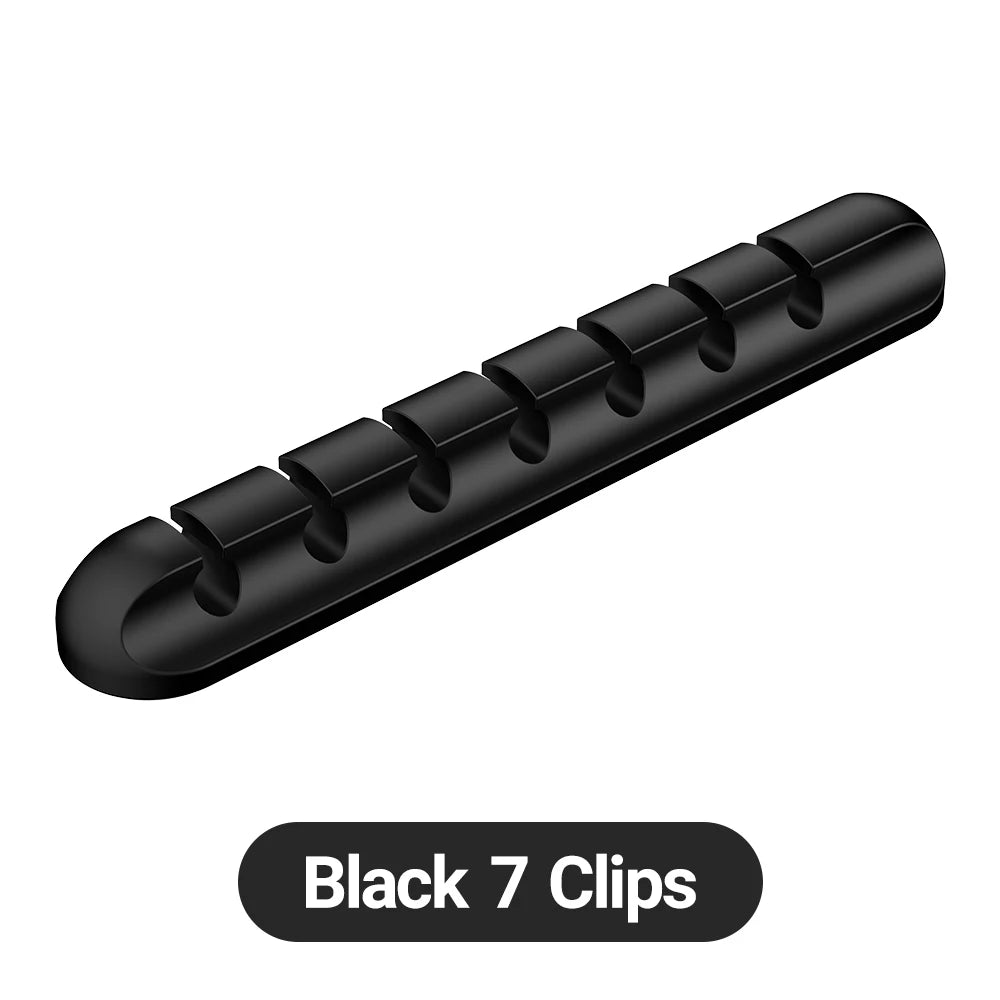 WireNest™ Adhesive Cable Holder by WaveGear Inc.™ secures and organizes cables with a clear plastic clip on a wall surface.